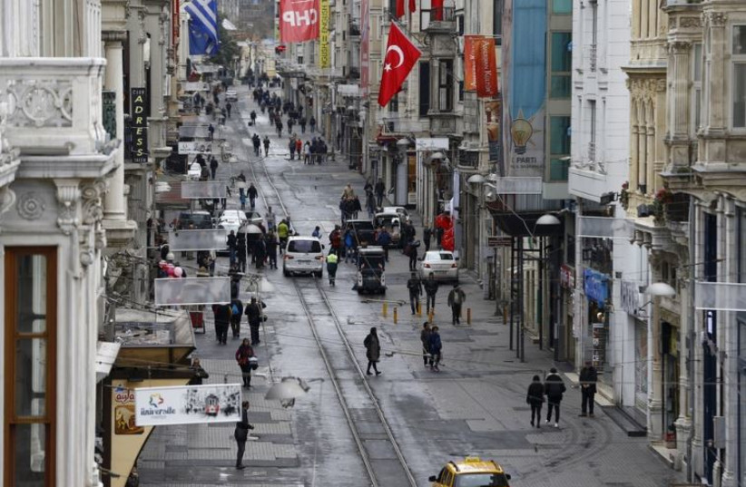 Pedestrians walk along Istiklal Street, a major shopping and tourist district, in central Istanbul