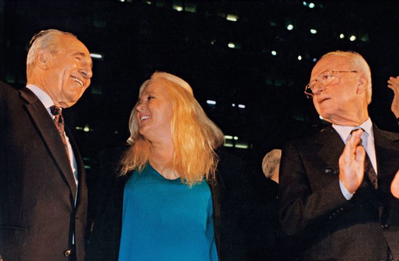 Shimon Peres sings alongside Miri Aloni and Yitzhak Rabin at a peace rally in Tel Aviv on November 4, 1995. Rabin was assassinated after the demonstration