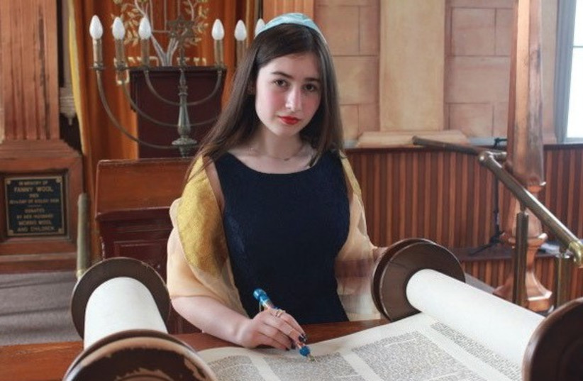 THE AUTHOR’S granddaughter reading from the Torah at her bat mitzvah. (photo credit: Courtesy)