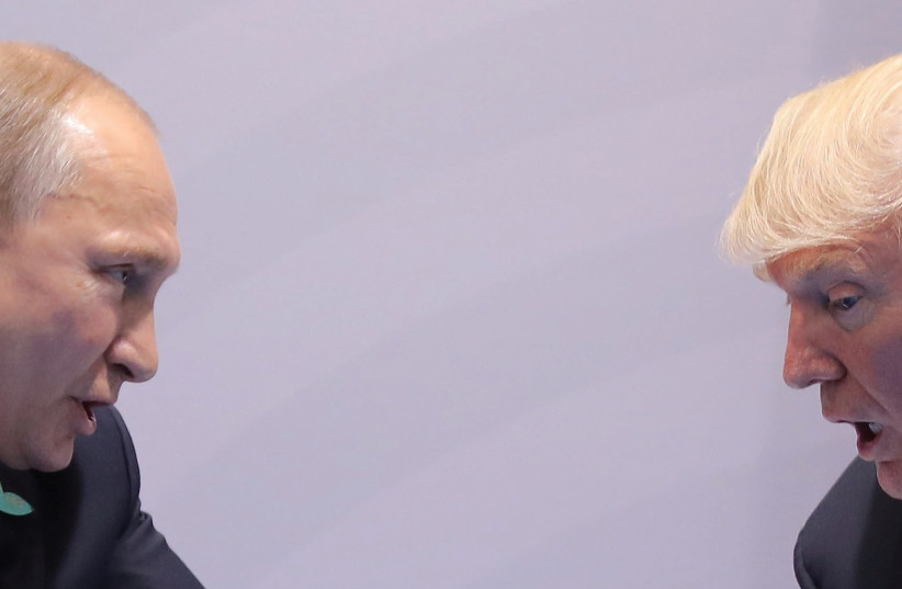 RUSSIA’S PRESIDENT Vladimir Putin talks to US President Donald Trump during their bilateral meeting at the G20 summit in Hamburg earlier this month (photo credit: REUTERS)