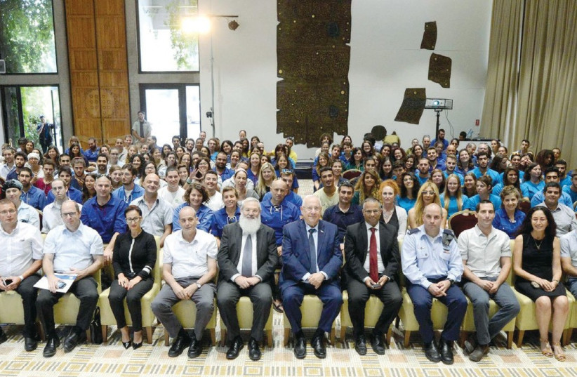 PARTICIPANTS IN the one-year voluntary service program (‘shnat sherut’) attend a ceremony at the President’s Residence yesterday (photo credit: Courtesy)