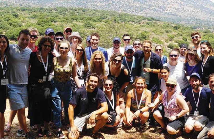 JNFuture members pose with volunteers of Hashomer Hahadash, a JNF-USA sponsored project, while touring the Galilee (photo credit: BOB BENEDON)