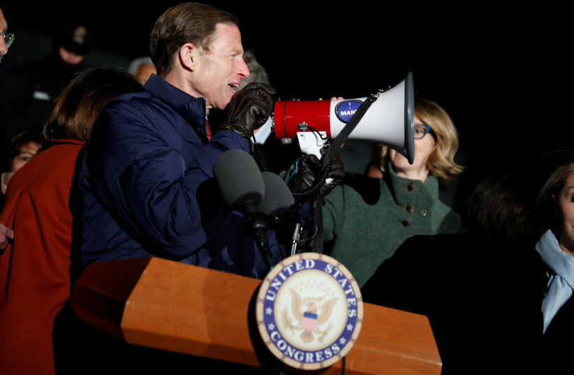 Sen. Richard Blumenthal (D-CT) speaks during a rally against President Donald Trump's travel ban outside the Supreme Court. (photo credit: REUTERS)