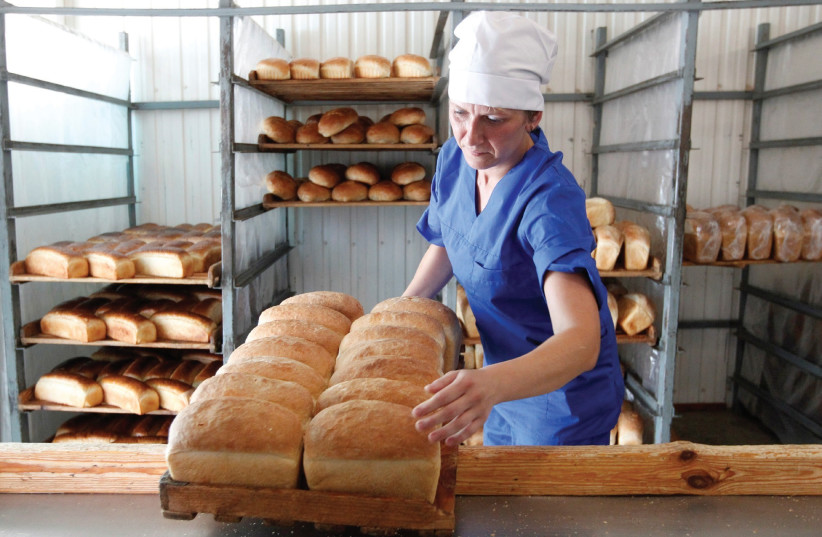 Baker and breads  (photo credit: EDUARD KORNIYENKO)