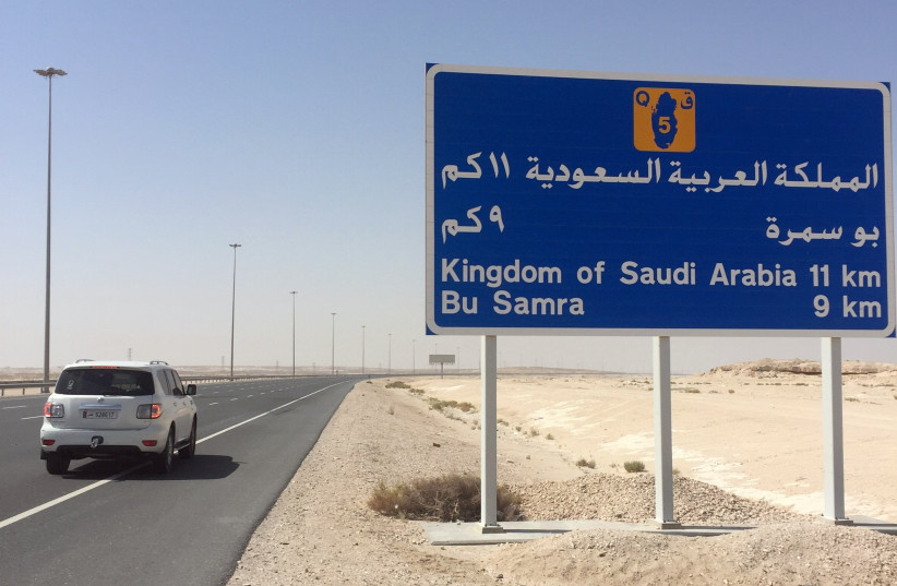 A road sign is seen near Abu Samra border crossing to Saudi Arabia, Qatar June 12, 2017. (photo credit: TOM FINN / REUTERS)
