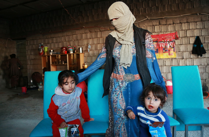 Displaced women and children from the minority Yazidi sect who were kidnapped by Islamic State militants of Tal Afar (photo credit: ARI JALAL / REUTERS)