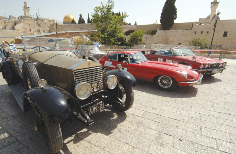 Vintage vehicles are parked near the Western Wall during a London-to- Jerusalem car rally raising (photo credit: AMOS BEN GERSHOM, GPO)