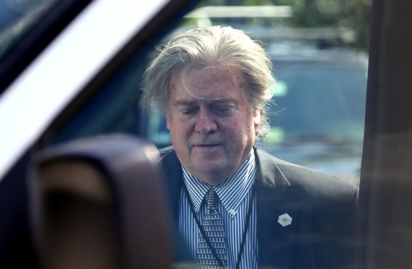 White House Chief Strategist Steve Bannon boards a vehicle as US President Donald Trump prepares to depart Mar-a-Lago estate in Palm Beach, Florida, US, April 9, 2017. (photo credit: REUTERS/CARLOS BARRIA)