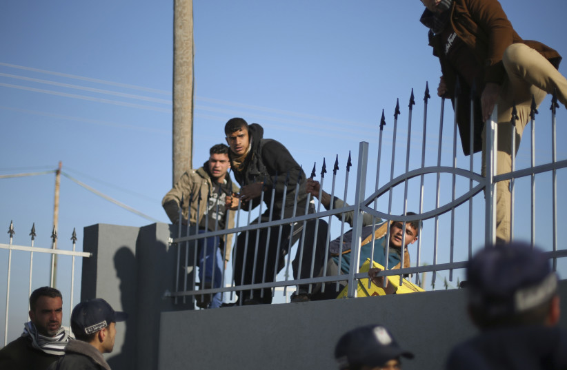 Gazans attempting to cross into Egypt at the Rafah crossing (photo credit: MOHAMMED SALEM/ REUTERS)