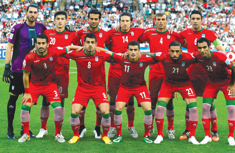 THE Iran team poses for a photo in 2015. Front row L to R: Ehsan Hajsafi, Morteza Pouraliganji, Vouria Ghafouri, Ashkan Dejagah and Mehrdad Pooladi. Back row L to R: Goalkeeper Alireza Haghighi, Sardar Azmoun, Masoud Shojaei, Andranik Teymourian, Seyed Jalal Hosseini and Javad Nekounam. (photo credit: JASON REED/REUTERS)