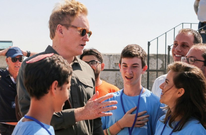 VISITING AMERICAN TV HOST and comedian Conan O’Brien interrupts high schoolers yesterday as they take part in a nonstop, 24-hour hackathon at Jerusalem’s Tower of David Museum. (photo credit: TOWER OF DAVID MUSEUM)