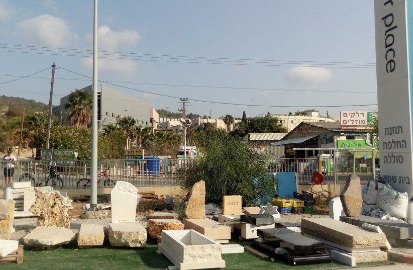 A truly better place: A former Better Place switching station in Beit Shemesh has been repurposed as a tombstonemaking business. (photo credit: YAKIR FELDMAN)