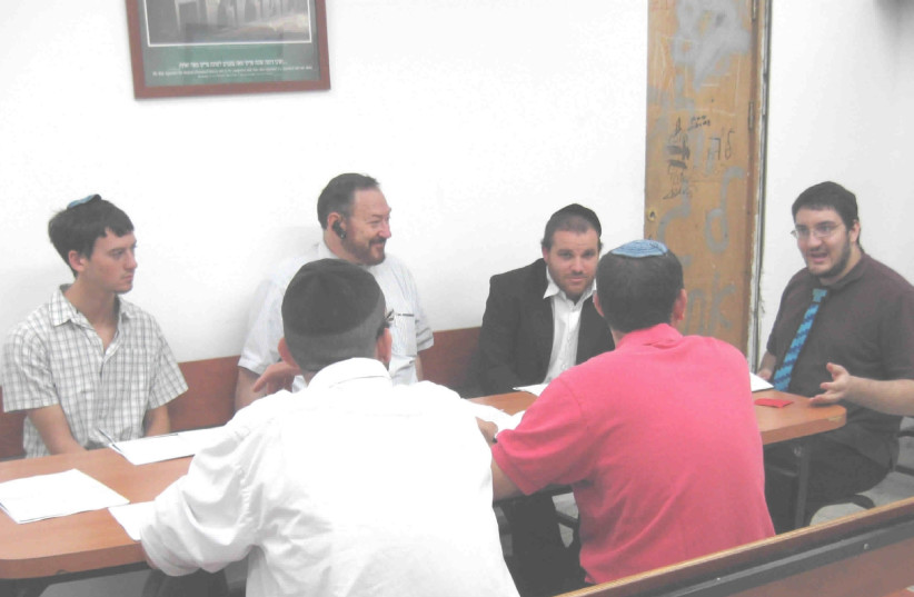 Rabbi Dr. Meir Zev Weiner helping people go on with their lives: A student-teacher training lesson. (photo credit: PR)