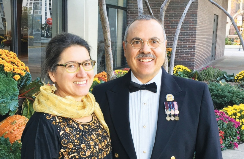 Retired admiral Jim Lando poses with his wife, Leigh Winston, who is also a physician. The two recently made aliya and hope to continue their work in public health while in Israel. (photo credit: Courtesy)