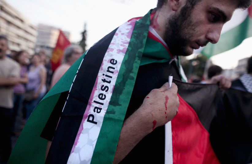 Pro-Palestinian rallier (photo credit: REUTERS/ALKIS KONSTANTINIDIS)