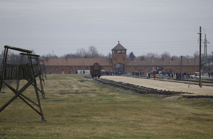 Visitors gather on the grounds of the former Nazi German concentration and extermination camp Auschwitz-Birkenau (photo credit: REUTERS)