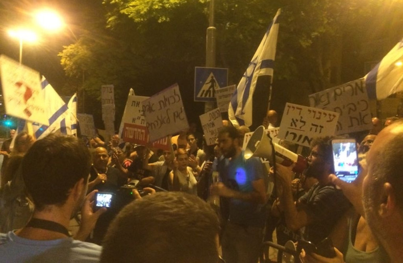 Right-wing activists and south Tel-Aviv residents protesting outside the house of the Supreme Court President Miriam Naor in Jerusalem. (photo credit: UDI SHAHAM)