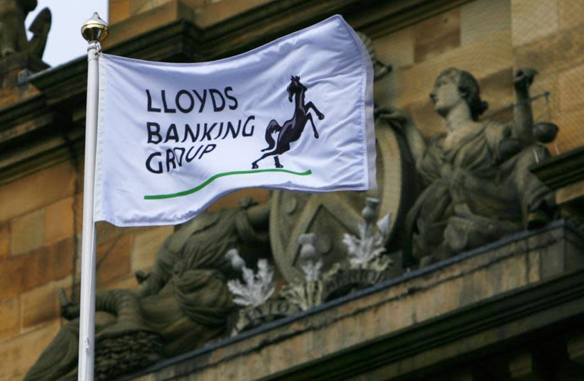 A Lloyds Banking Group flag flies over their Scotland headquarters in Edinburgh, Scotland. (photo credit: REUTERS)