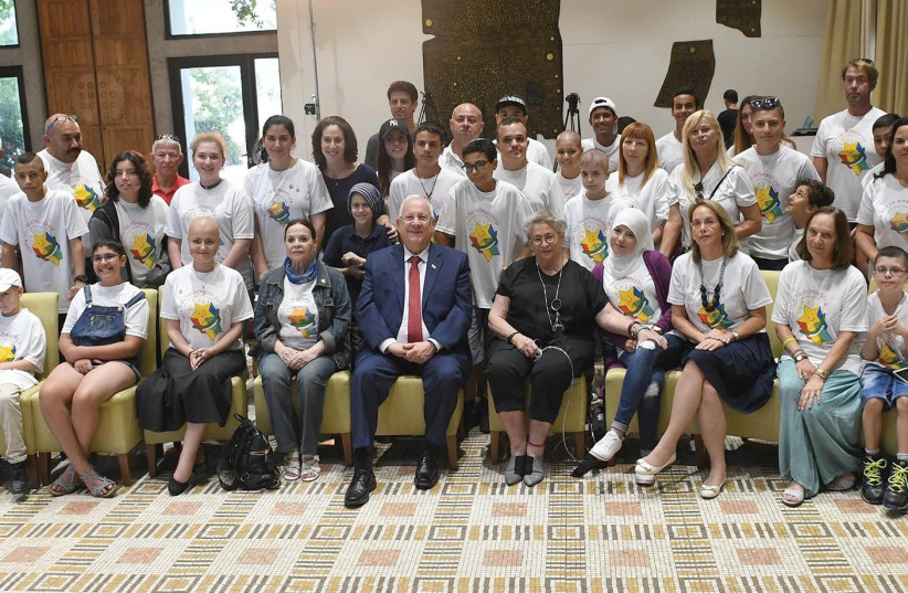 President Rivlin meets with cancer patients at his residence, September 2017 (photo credit: MARC NEYMAN/GPO)