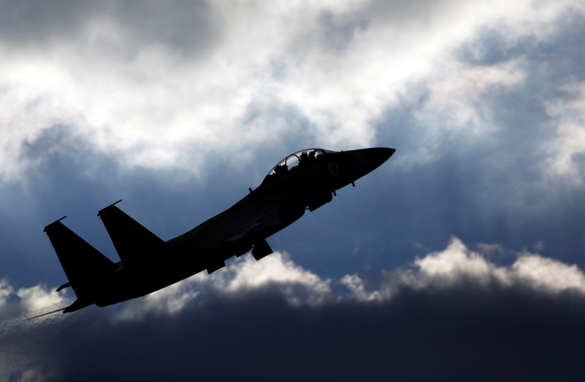 An Israeli Air Force F-15 fighter jet flies during an aerial demonstration (photo credit: AMIR COHEN - REUTERS)