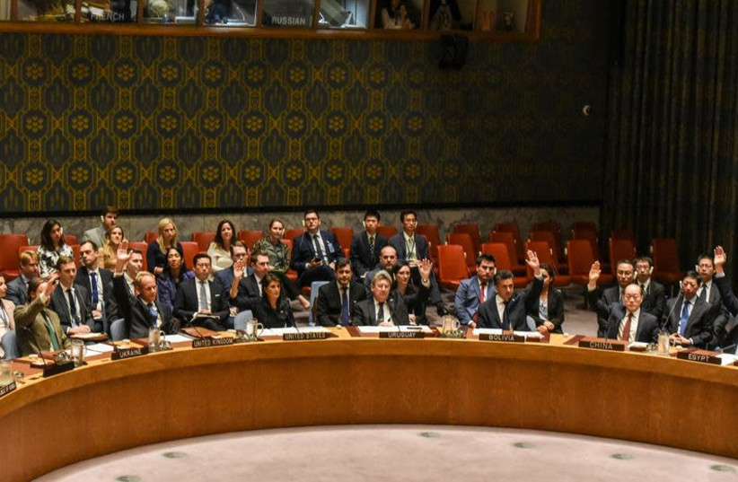 Ambassadors to the UN vote during a United Nations Security Council meeting on North Korea in New York City, US, September 11, 2017.  (photo credit: REUTERS/STEPHANIE KEITH)