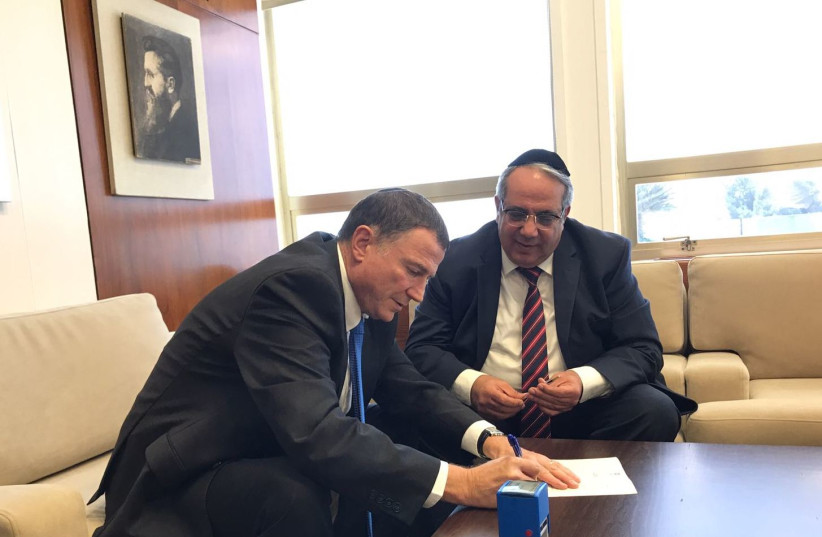 MK Yigal Gueta formally submits his letter of resignation as a member of Knesset to Knesset Speaker Yuli Edelstein (photo credit: OFFICE OF KNESSET SPEAKER YULI EDELSTEIN)