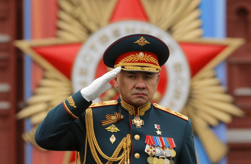 Russian Defense Minister Sergei Shoigu salutes (credit: REUTERS / YURI KOCHETKOV / POOL)
