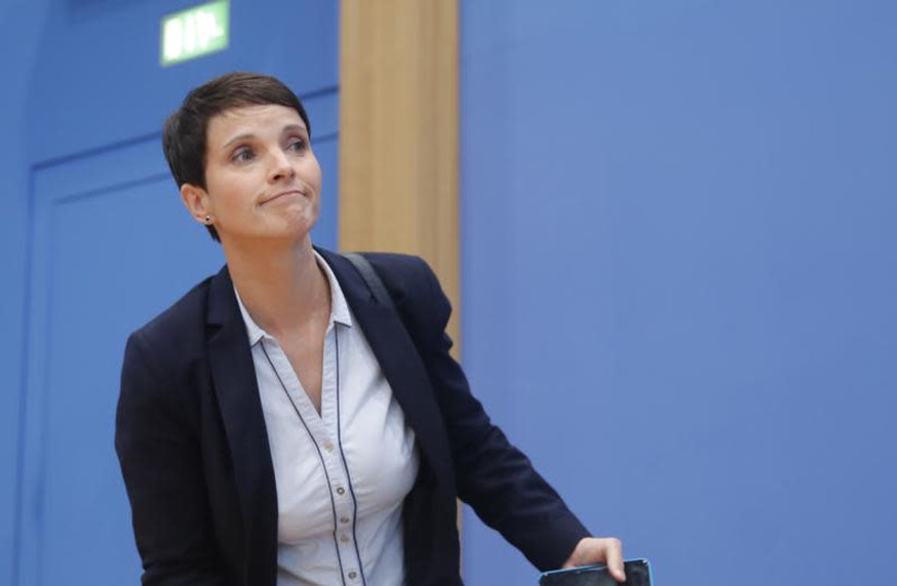 Frauke Petry, chairwoman of the anti-immigration party Alternative fuer Deutschland (AfD) reacts during a news conference in Berlin, Germany, September 25, 2017.  (photo credit: WOLFGANG RATTAY / REUTERS)