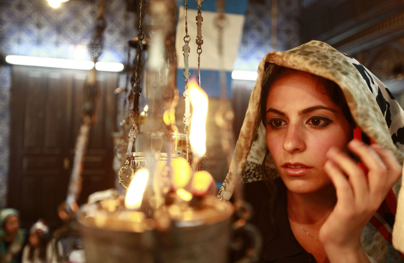 A Jewish worshipper prays during a pilgrimage to the El Ghriba synagogue in Djerba (photo credit: ANIS MILI / REUTERS)