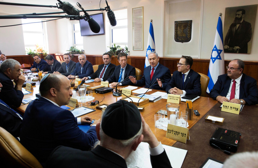 Israeli Prime Minister Benjamin Netanyahu (3rd R) attends the weekly cabinet meeting at his office in Jerusalem October 1, 2017. (photo credit: REUTERS)