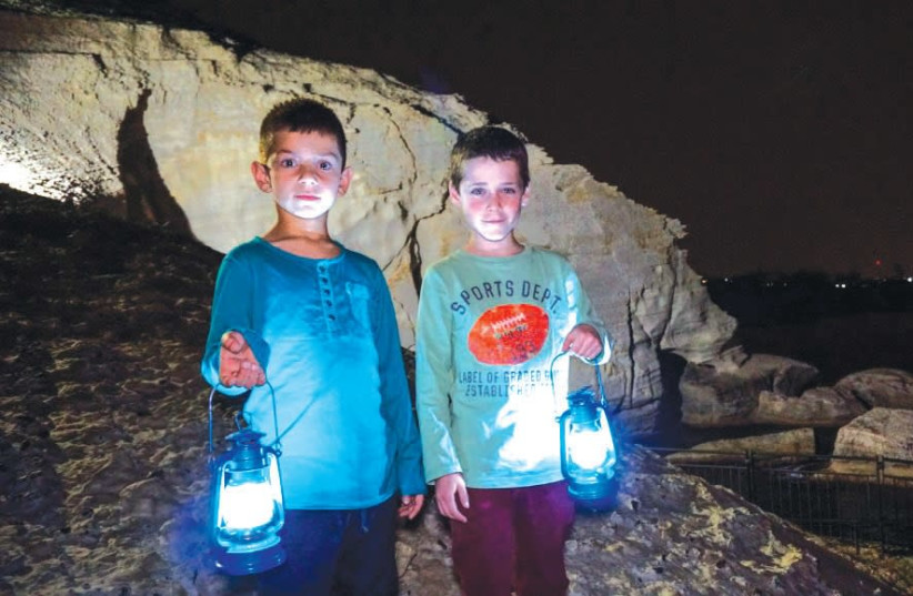 VISITORS to the Rosh Hanikra grottoes are given lanterns for night tours and experience a unique light show. (photo credit: PR)