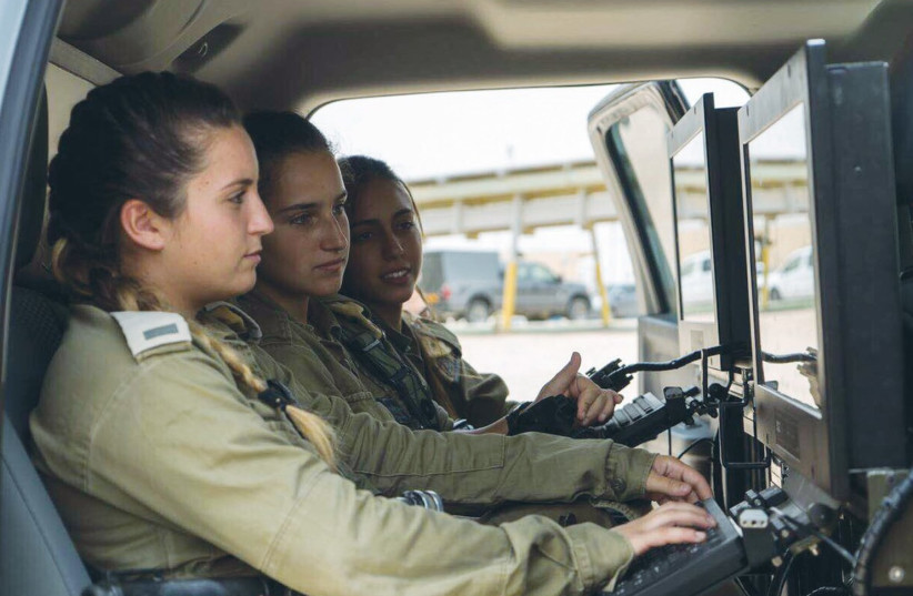 FEMALE COMBAT intelligence-gathering soldiers use the ‘Granit’ tactical reconnaissance vehicle. (photo credit: IDF SPOKESPERSON'S UNIT)