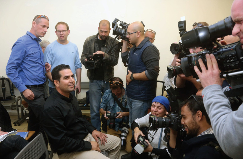 MENI NAFTALI speaks with reporters at a courthouse in Jerusalem in 2014. At the time, he sued the Netanyahus for their alleged mistreatment while serving as chief caretaker of the PM’s residence. (photo credit: MARC ISRAEL SELLEM)