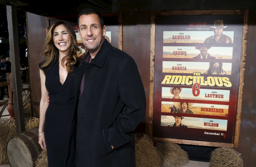 Adam Sandler and his wife Jackie (photo credit: MARIO ANZUONI/REUTERS)