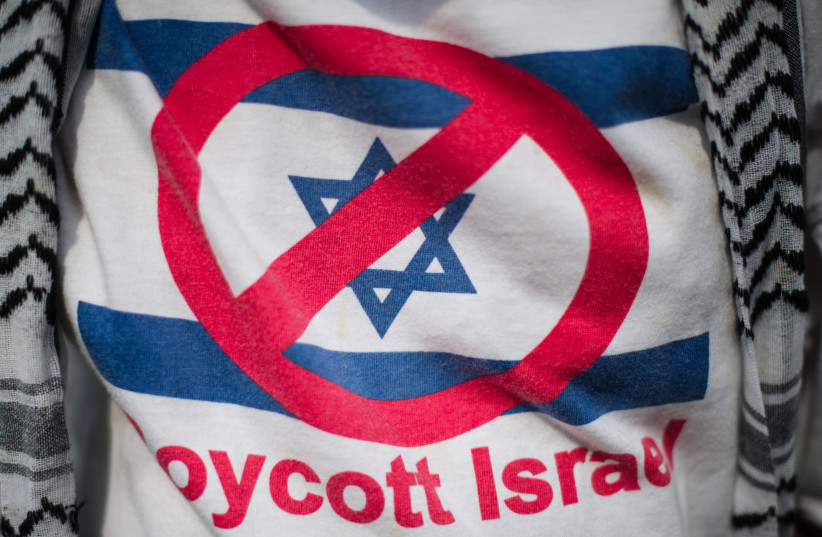 A supporter wears a T-shirt reading 'Boycott Israel' (photo credit: AFP/ MOHD RASFAN)