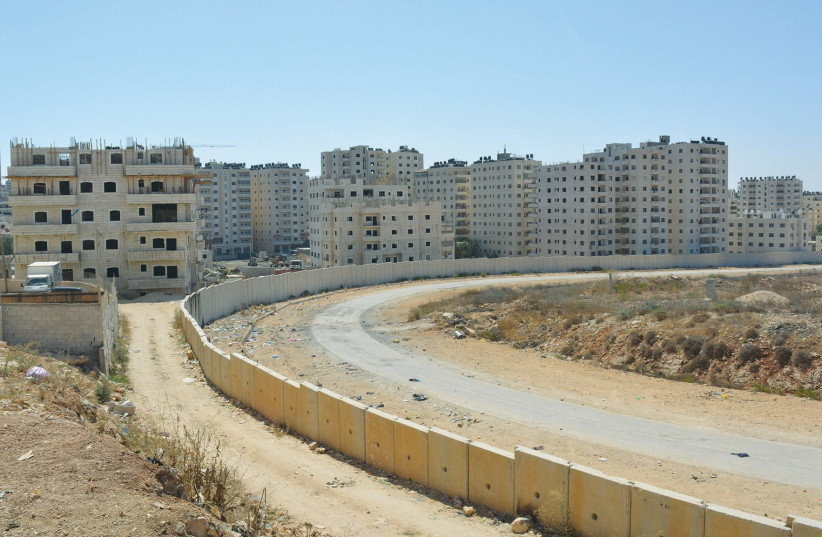SINCE IT was separated from central Jerusalem by the security barrier, numerous illegal highrise buildings have been constructed in the Kafr Akab neighborhood. (photo credit: UDI SHAHAM)