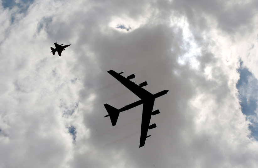 A U.S. B52 plane (R) flies during Exercise Eager Lion at one of the Jordanian military bases in Zarqa, east of Amman, Jordan, May 24, 2016.  (photo credit: MUHAMMAD HAMED / REUTERS)