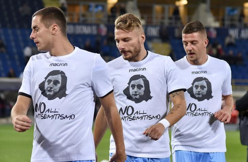 Lazio's players Ciro Immobile (C), Adam Marusic (L) and Sergej Milinkovic-Savic wear a shirt with a picture of Anne Frank before their Serie A soccer match against Bologna at the Dall'Ara stadium in Bologna, Italy October 25, 2017. (photo credit: REUTERS/ALBERTO LINGRIA)