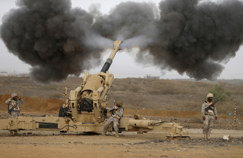 Saudi army artillery fire shells towards Houthi positions from the Saudi border with Yemen April 13, 2015.  (photo credit: REUTERS)
