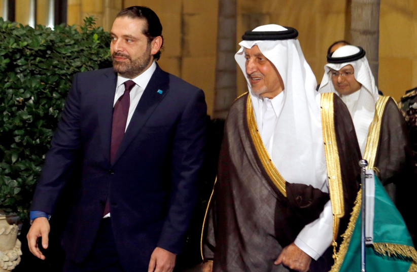 Saad Hariri walks with Saudi Arabia's Prince Khaled al-Faisal in Beirut, Lebanon November 21, 2016.  (photo credit: MOHAMED AZAKIR / REUTERS)