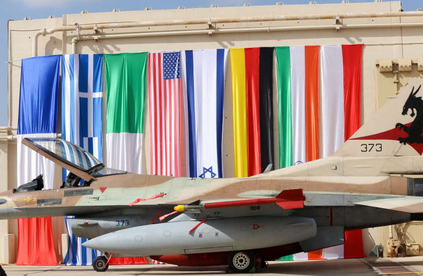 Israeli F16 stationed next to flags of participating nations (photo credit: ANNA AHRONHEIM)
