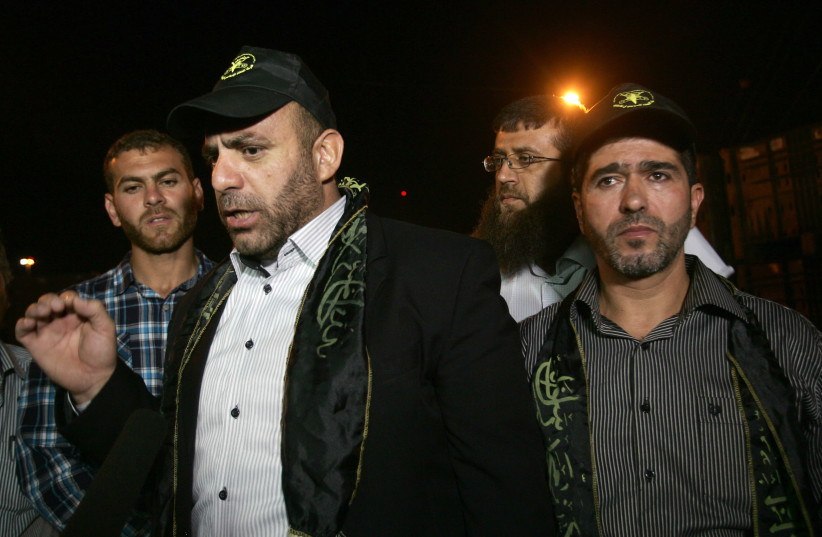 Palestinian leaders of the Islamic Jihad movement in the West Bank, Jaafar Ezzeddine (R) and Tariq Qaadan (C) answer journalists' questions after their release from an Israeli prison in the West Bank city of Jalama, near Jenin, on May 8, 2013. (photo credit: SAIF DAHLAH / AFP)