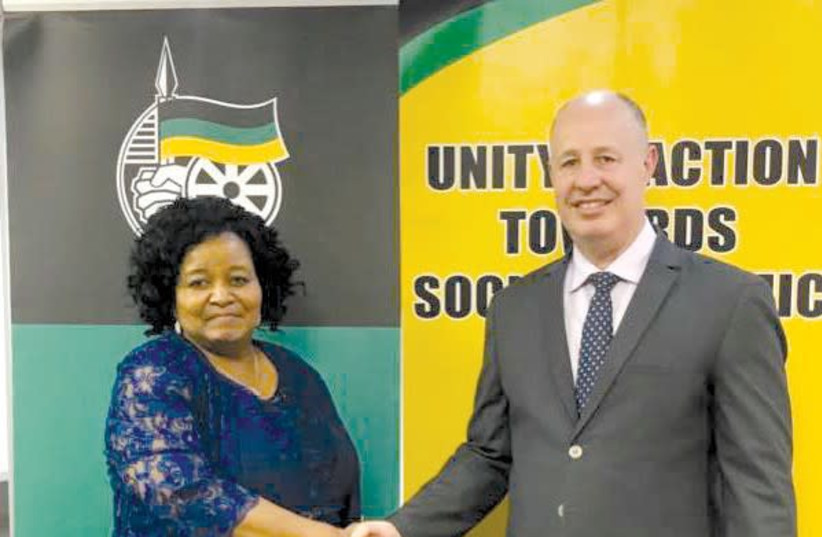 Regional Cooperation Minister Tzachi Hanegbi shakes hands with the ANC’s International Relations Subcommittee chairwoman Edna Molewa at their meeting in South Africa last week (photo credit: FACEBOOK)