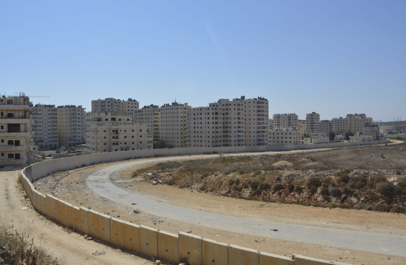 A view of Kafr Akab, one of the neighborhoods behind the security barrier that would be affected by Elkin's plan. (Udi Shaham) (photo credit: UDI SHAHAM)