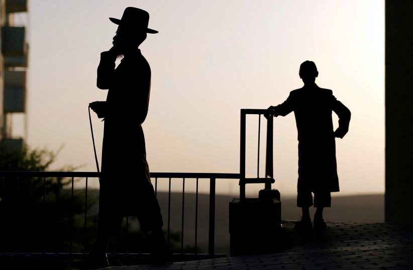 Ultra-Orthodox Jewish men are seen in the southern city of Arad, Israel October 2, 2017. (photo credit: REUTERS/AMIR COHEN)