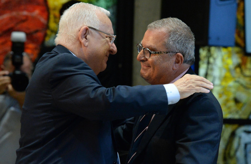 Israeli President Reuven Rivlin and national chairman for the Organization of Victims of Terrorism Abie Moses (photo credit: Mark Neiman/GPO)