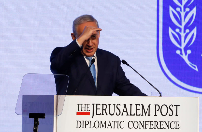 Israeli Prime Minister Benjamin Netanyahu speaks at the Jerusalem Post Diplomatic Conference in Jerusalem (photo credit: RONEN ZVULUN / REUTERS)