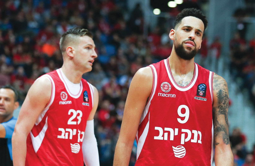 Hapoel Jerusalem forward Austin Daye (right) had every reason to look dejected last night after the team dropped to a 92-75 defeat at Buducnost in Eurocup action in Montenegro. (photo credit: DANNY MARON)