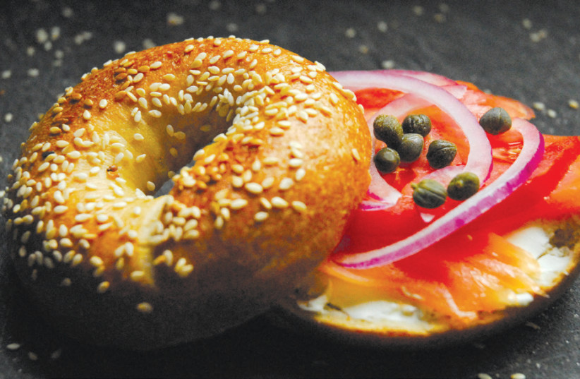 A HOMEMADE bagel with fresh gravlax from ‘Modern Jewish Baker.’  (photo credit: SHANNON SARNA)