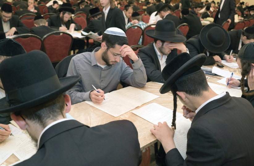 A typical scene at a Dirshu testing site, where Jews, young and old, and from all backgrounds, gather each month in dozens of locations worldwide (photo credit: DIRSHU)